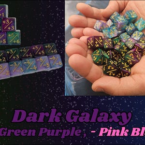 May include: Dice in green, purple, and blue with gold numerals. Some are stacked, others held in hands. The text "Dark Galaxy (+ Green Purple; - Pink Blue)" is displayed at the bottom. The dice are for tabletop games.