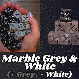May include: A collection of marble grey and white dice. Some dice are held in a cupped hand, while others are stacked. The dice have white numbers and symbols. The text "Marble Grey & White (+ Grey, - White)" is at the bottom.