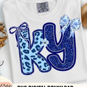May include: White Comfort Colors t-shirt with the letters "KY" in blue. The "K" has a light blue leopard print, and the "Y" is a glittery blue. Both letters have blue bows and a small flower. The words "PNG DIGITAL DOWNLOAD" are at the bottom.