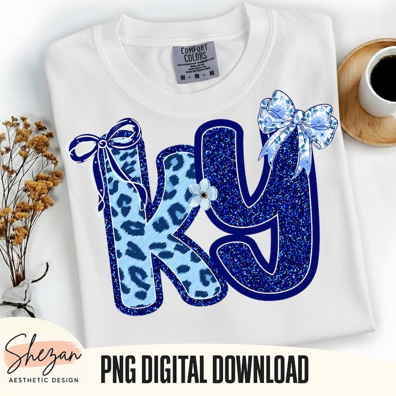 May include: White Comfort Colors t-shirt with the letters "KY" in blue. The "K" has a light blue leopard print, and the "Y" is a glittery blue. Both letters have blue bows and a small flower. The words "PNG DIGITAL DOWNLOAD" are at the bottom.