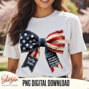 以下が含まれることがあります： アメリカ国旗をモチーフにしたリボンデザインの白いTシャツ。リボンには星とストライプがあり、「We The People」と「250 Years of Freedom」の文字が書かれています。「PNG DIGITAL DOWNLOAD」の文字も表示されています。