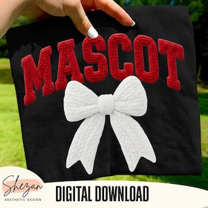 May include: Black t-shirt featuring the word "MASCOT" in red, textured letters and a large white bow. The words "DIGITAL DOWNLOAD" are printed in white at the bottom. The shirt is held up by a hand.