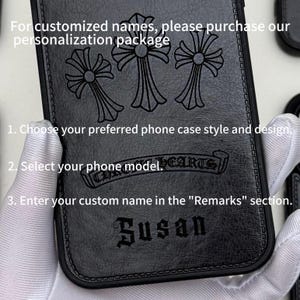 May include: Black phone case with a decorative cross design and the name "Susan" embossed on the front. The case has a textured surface and includes instructions for customization. The text on the case reads "CHROME HEARTS".