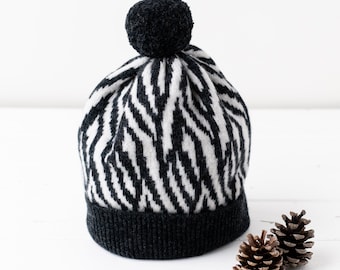 Zebra knitted pom pom hat - monochrome