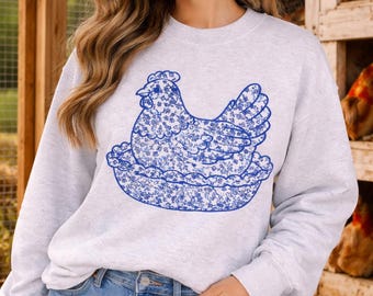 Camisa con gallina bordada en el nido