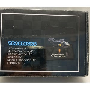 May include: A black box with the text "YEABRICKS" and "LED LIGHTING KIT". The box also features an image of a Razor Crest model and the text "ITEM NO.:LLK552 The Razor Crest 75331".