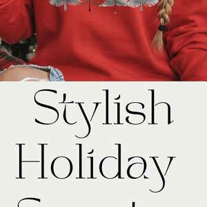 May include: Stylish holiday sweater in olive green, red, and cream colors. The design features a watercolor illustration of four Christmas trees. The text "Stylish Holiday Sweater" is also visible.