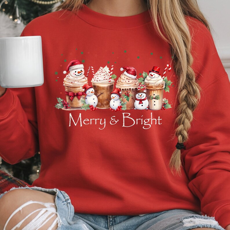 Holiday Coffee Design Sweatshirt Christmas Festive Apparel Merry Bright Winter Wear Snowman Cup Illustration Whipped Cream Topping Candy Cane Detail Holly Berry Accent Red Green Stars Cotton Blend Comfort Seasonal Celebration Outfit