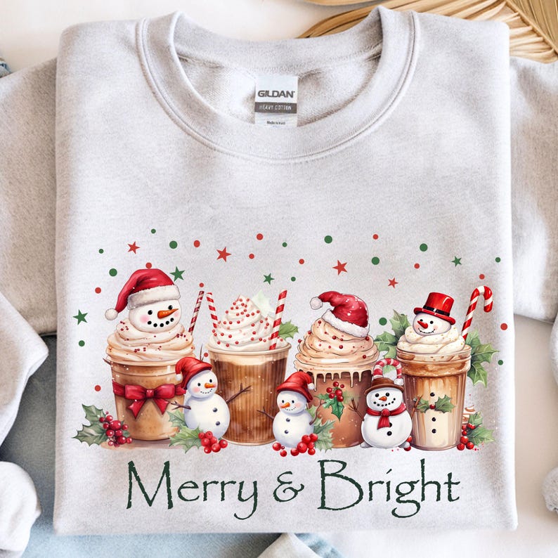Festive Christmas Sweatshirt Coffee Cup Design Holiday Apparel Collection Merry Bright Saying Snowman Whipped Topping Holly Berry Decoration Candy Cane Accent Winter Seasonal Wear Comfortable Cotton Blend Multiple Size Options Holiday Party
