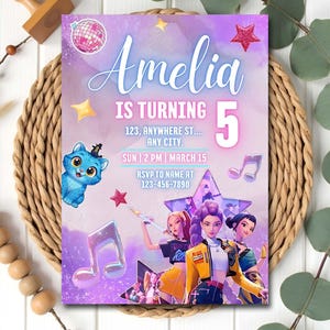 May include: A birthday party invitation with a purple and pink theme. The invitation says "Amelia is turning 5" and includes event details. A cartoon cat, musical notes, and stars decorate the invitation.