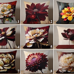 May include: Nine decorative cushions, each with a striking floral design. The cushions display various flowers in full bloom, with a palette of red, yellow, and white hues. The artwork has a painterly style, adding a touch of elegance. Each cushion is approximately 40cm x 40cm.