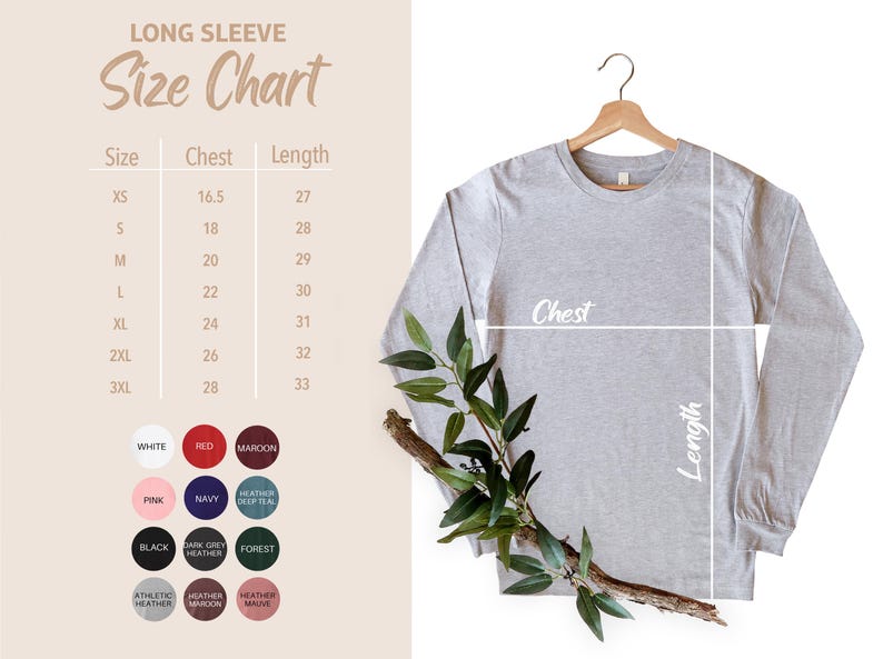 May include: A light gray long-sleeve shirt hanging on a wooden hanger, with a size chart and color swatches to the left. The size chart shows chest and length measurements in inches. A sprig of greenery is draped across the shirt.