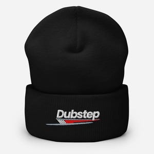 May include: Black beanie with the word "Dubstep" embroidered in white, red, and silver. The hat is a classic, cuffed style, perfect for keeping warm. The beanie is made of a soft, knit material.