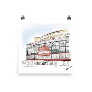 May include: Watercolor print of Wrigley Field, home of the Chicago Cubs. The artwork depicts the stadium's exterior with a red sign that reads "Wrigley Field Chicago Cubs Cardinals vs Cubs 7:05 PM". The print includes the artist's signature.