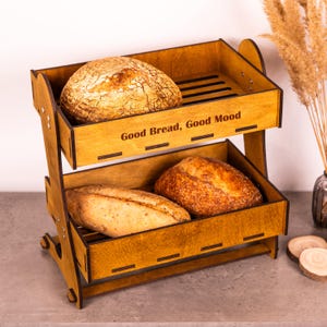 May include: A set of three ceramic mugs with a speckled, matte finish. The mugs are in shades of cream, light gray, and dark gray. Each mug has a simple, minimalist design, perfect for coffee or tea.