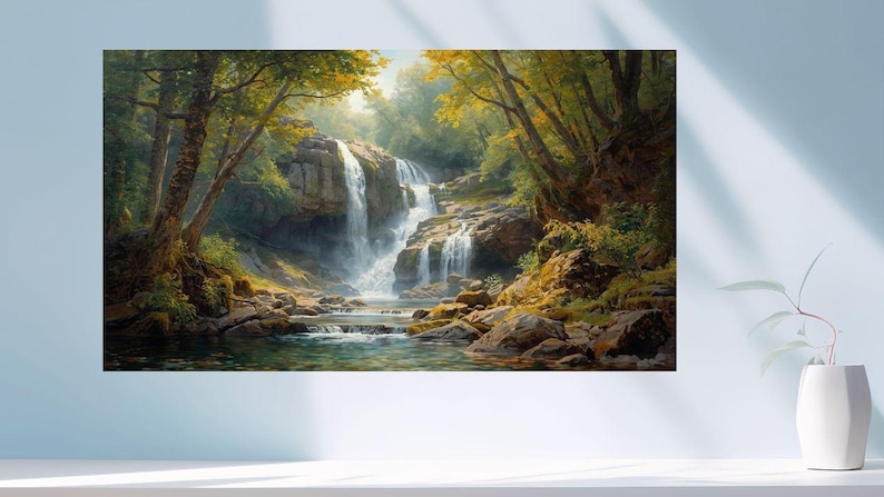 May include: A landscape painting depicts a cascading waterfall in a lush forest. The artwork features a vibrant color palette of greens, browns, and yellows, with the waterfall's white water contrasting the surrounding foliage and rocks. The painting is displayed on a wall.