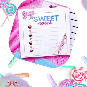 May include: A white notepad with the words "SWEET notes" in blue and pink, decorated with cupcake and heart illustrations. The notepad is adorned with a bow and a pink pen illustration. The image also features colorful lollipops and the text "Unique Stationery Shop".