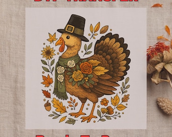 May include: DTF transfer featuring a cartoon turkey wearing a pilgrim hat and scarf, surrounded by fall leaves and flowers. The turkey is brown, orange, and yellow, with a black hat and green scarf. Text at the top reads "DTF TRANSFER" and at the bottom "Ready To Press".