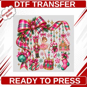 May include: A DTF transfer sheet featuring a Christmas-themed design with a large pink and green plaid bow, a nutcracker, a ballerina, a gingerbread house, a candy cane, a drum, a gift box, a stocking, and ornaments with the text Personalized Design.
