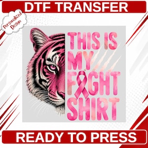 May include: A DTF transfer featuring a half-face tiger illustration in shades of pink and black, alongside the pink watercolor-style text THIS IS MY FIGHT SHIRT with a pink awareness ribbon replacing the letter I in FIGHT.