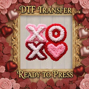 May include: A decorative DTF transfer design featuring the letters "XO" in a heart-shaped design. The letters are made of pink, red, and white fluffy material. The words "DTF TRANSFER" and "READY TO PRESS" are displayed in gold lettering.
