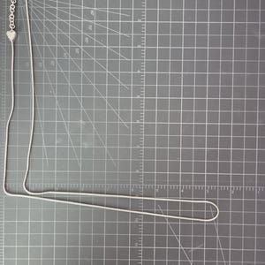 May include: A set of three ceramic mugs with a speckled, matte finish. The mugs are in shades of cream, light gray, and dark gray. Each mug has a simple, minimalist design, perfect for coffee or tea.