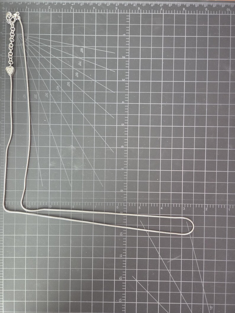 May include: A set of three ceramic mugs with a speckled, matte finish. The mugs are in shades of cream, light gray, and dark gray. Each mug has a simple, minimalist design, perfect for coffee or tea.