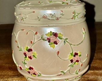 Vintage ceramic jar/planter with lid. Cream colored with raised floral pattern.