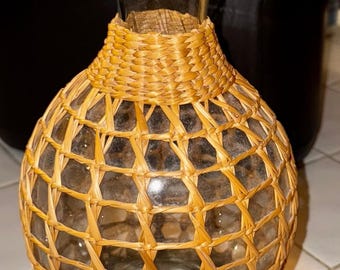 Decanter or Decorative Vase Made Out of Glass Covered With Seagrass or Wicker