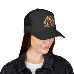 May include: Black trucker hat featuring a colorful lion graphic. The lion design incorporates shades of orange, red, and blue. The hat has a mesh back and a curved brim.