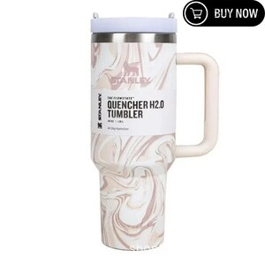 May include: A stainless steel Stanley Quencher H2.0 Tumbler with a white and pink marble design. It has a white handle and lid, and the text "QUENCHER H2.0 TUMBLER" is printed on the front. The tumbler holds 40 oz (1.18 L).