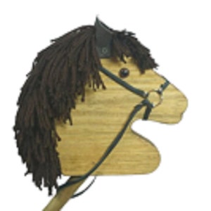 May include: A wooden toy horse head with a brown yarn mane and a black leather bridle. The horse has a brown wooden body and a black leather strap for holding.