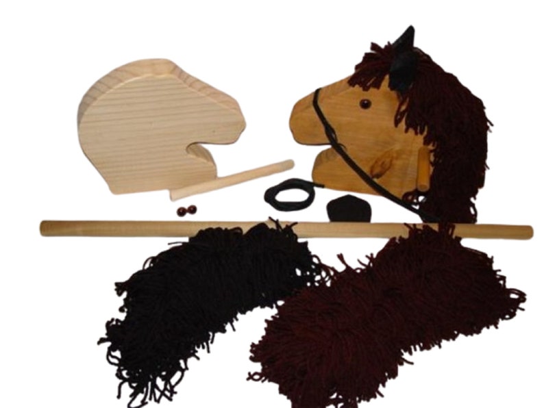 May include: Wooden toy horse head with a brown mane and tail, a black bridle, and a wooden stick for riding. The horse head is unfinished and ready to be painted.