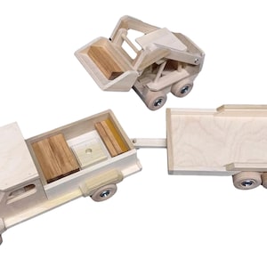 May include: A wooden toy truck with a flatbed trailer and a separate wooden toy forklift. The truck has a wooden bed with a removable wooden box and a wooden plank. The trailer has a flatbed with a ramp. The forklift has a lifting arm and a bucket.