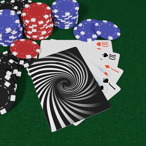 May include: Poker game scene with playing cards and poker chips. The cards show a ten of hearts, ten of diamonds, ten of spades, and a card with a black and white spiral design. Stacks of red, blue, and black poker chips are also visible.