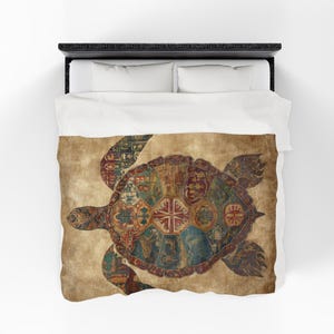May include: A decorative comforter featuring a detailed turtle design. The turtle's shell is composed of various colorful, patterned segments, set against a tan background. The design is reminiscent of a vintage map or tapestry, adding a unique aesthetic to the bedding.