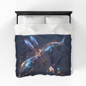 May include: A duvet cover featuring a dark navy blue background with a glowing, ethereal bow and arrow design. The bow and arrows are rendered in luminous shades of blue, purple, and orange light, creating a vibrant, abstract, and energetic visual effect.