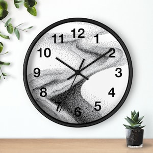 May include: A round wall clock with a black frame and a white face featuring a black stippled abstract wave pattern. The clock has black hour, minute, and second hands, and large black sans-serif numerals from one to twelve around the dial.