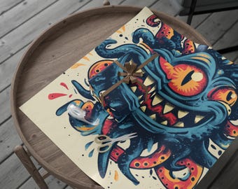 May include: A gift wrapped in paper featuring a blue, orange, and red monster design. The gift is tied with a brown ribbon. Scissors and tape are on the wrapping paper. The paper has a cream background.