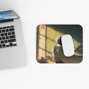 May include: Mousepad featuring an artistic depiction of a person writing on a chalkboard, with a white mouse and a laptop visible. The image has a warm, golden color palette, suggesting a classroom setting.