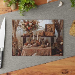 May include: A rectangular cutting board with a rustic, bohemian-style table setting. The table is adorned with a floral arrangement, candles, and woven baskets. The color palette includes warm tones of brown, beige, and orange.