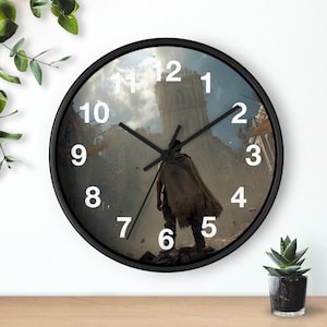May include: Black-framed wall clock featuring a dramatic scene of a figure in a cloak standing before a ruined building. The clock face displays white numerals against the backdrop of a post-apocalyptic landscape. The clock hands are black.