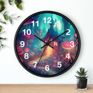 May include: A round wall clock with a black frame. The clock face features a whimsical illustration of a fantasy landscape with a house, mushrooms, and a path. The clock hands are black, and the numbers are white.