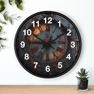 May include: A round wall clock with a black frame and a face featuring a weathered, rusted metal texture in shades of blue and orange. The clock displays white Arabic numerals from 1 to 12 and black hour, minute, and second hands.