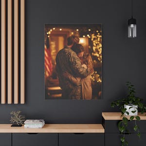 May include: A canvas print shows a loving embrace between three people. A person in military uniform embraces two others, with a blurred background of a house decorated with lights and a flag.
