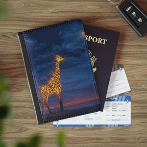 May include: A passport cover with a giraffe design, a passport, and two boarding passes. The cover features a giraffe with a fiery pattern against a dark blue sky and sunset. The passport is navy blue with gold lettering.