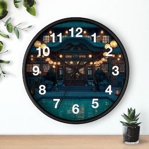 May include: A round black wall clock with a detailed image of a Japanese building at night. The clock face features white numerals and hands, with a black border. The background shows a building with lanterns.