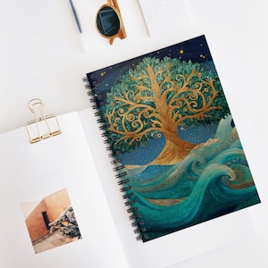 May include: Spiral-bound notebook featuring a detailed illustration of a golden tree with green leaves against a dark blue starry sky. The tree is set above teal waves, creating a nature-inspired design.