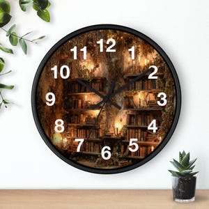 May include: Round wall clock with a black frame. The clock face features a detailed image of a library with bookshelves, candles, and a warm, inviting atmosphere. White numerals mark the hours.