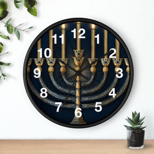 May include: A round wall clock with a black frame. The clock face features a gold menorah design against a dark blue background. The clock hands are black, and the numbers are white.